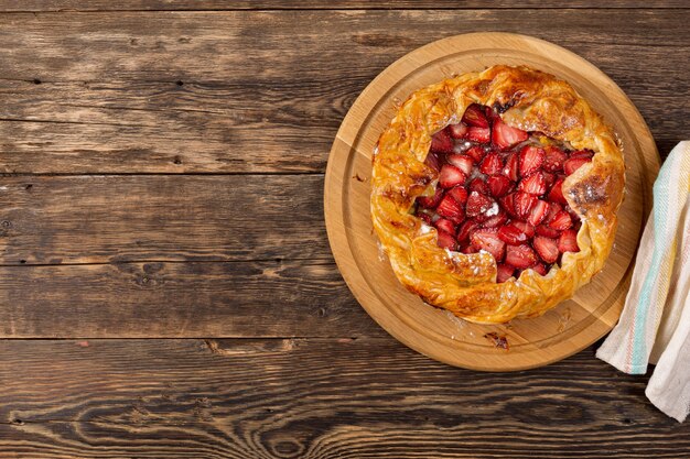 Homemade baking pie with strawberries. view from above