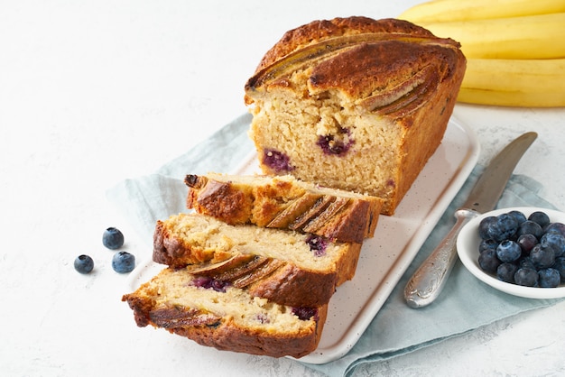 Homemade Banana bread. Baked cake. Top view, white table.