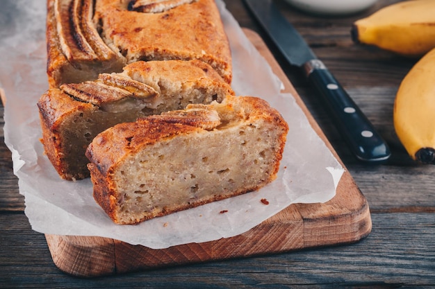 Homemade banana bread on a wooden rustic background