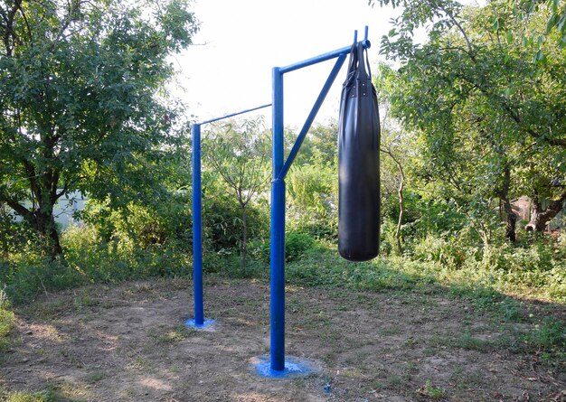 Homemade bar with a punching bag outdoors in the garden