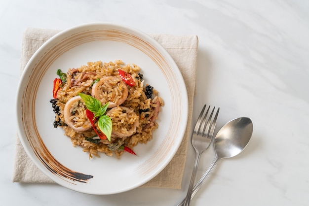 Homemade Basil and Spicy Herb Fried Rice with Squid or Octopus - Asian food style