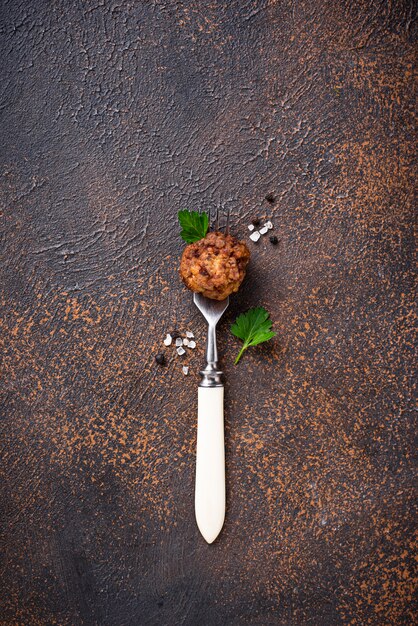 Homemade beef meatball on fork