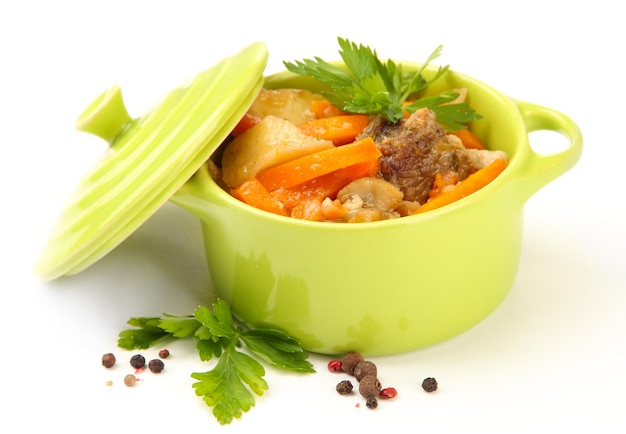 Homemade beef stir fry with vegetables in color pan isolated on white