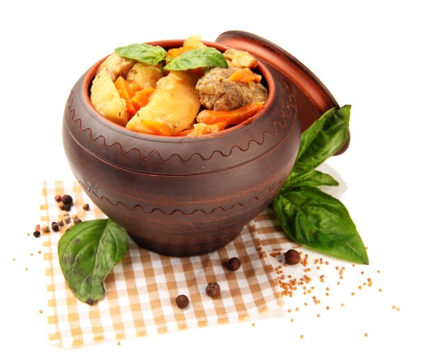 Homemade beef stir fry with vegetables in pot isolated on white