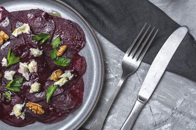 Homemade Beet Salad with Walnuts, Mozzarella, Parsley, and Cherry Tomatoes. Vegan food concept