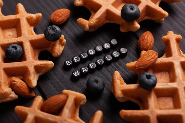 Photo homemade belgian waffles closeup with inscription