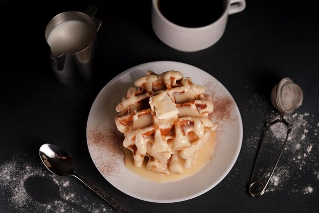 Homemade of Belgian Waffles Plate on a Black concrete Background