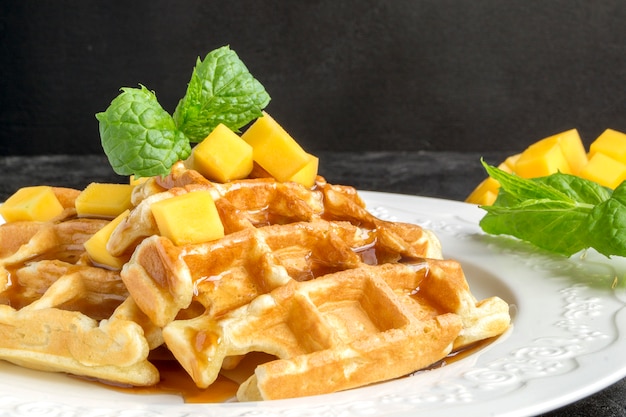 Homemade Belgian waffles with caramel syrup.