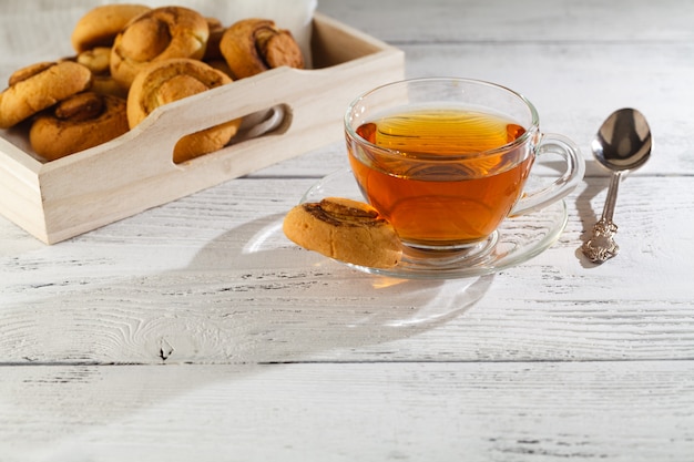 Homemade biscuits and a cup of tea on the table in the morning