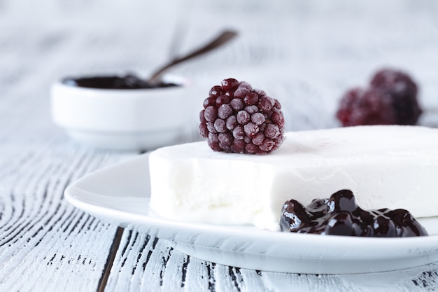 Homemade blackberry ice cream on a rustic background