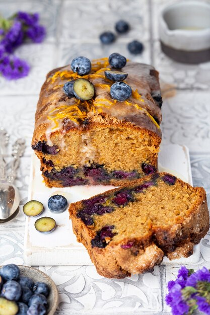 Homemade blueberry cake with orange zest and icing sugar