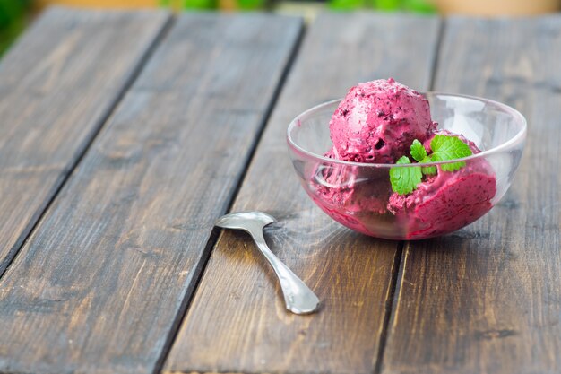 Homemade blueberry ice cream  in a glass dish
