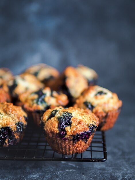 Homemade blueberry muffins on dark 