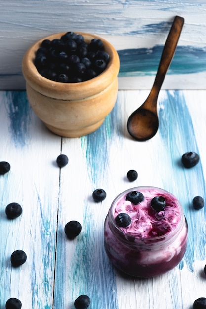 Homemade blueberry yogurt in glass bowls, healthy breakfast,