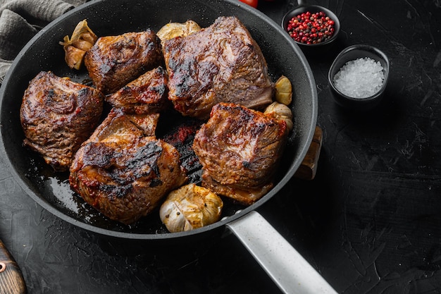 Homemade Braised Beef Short Ribs set, on black stone background