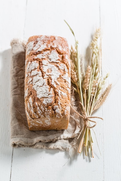 Homemade bread with several grains with ears of wheat