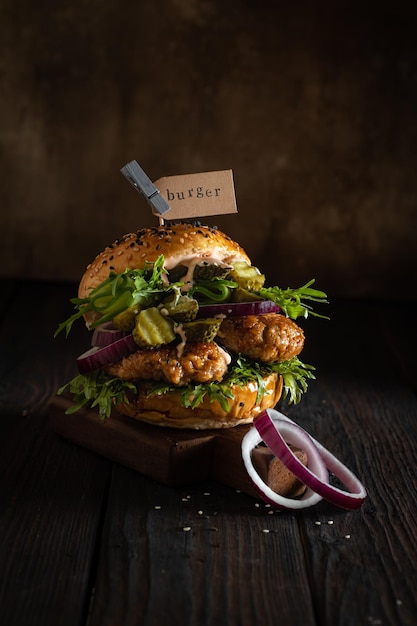 Homemade burger with vegetables and beef patty closeup vertical