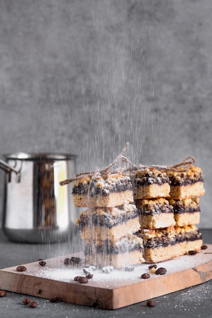 Homemade cakes for breakfast Sprinkle coffee biscuits with powdered sugar Dropping Powdered sugar for dessert