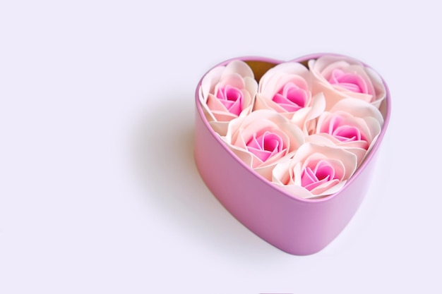 Homemade candies in the form of roses in a gift pink box