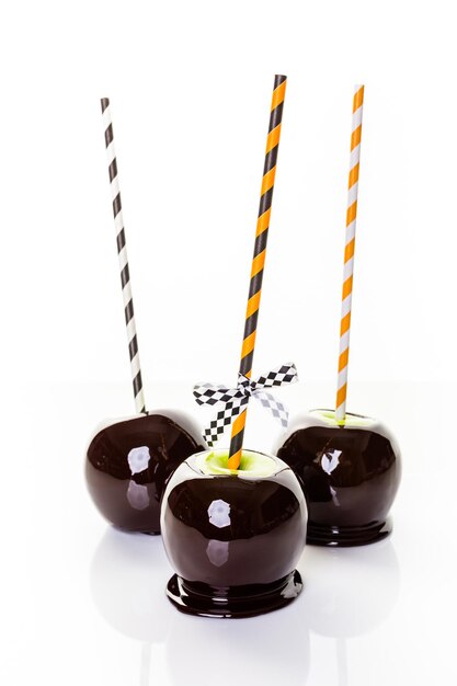 Homemade candy apples on a white backgeound.