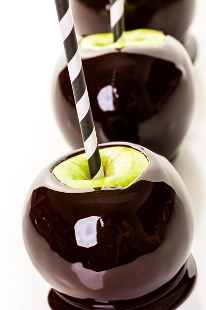 Homemade candy apples on a white backgeound.