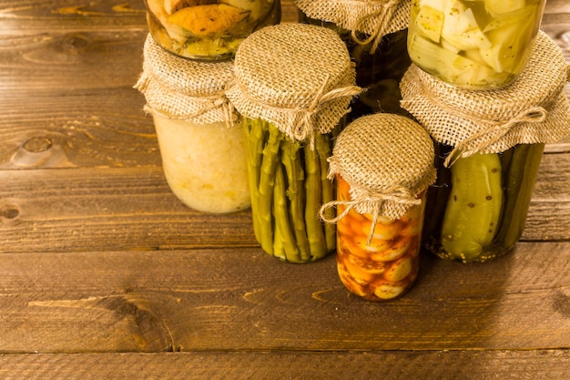 Homemade canned organic vegetables in glass jars.