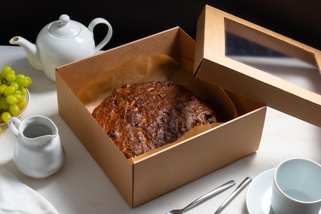 Homemade carrot cake on white wooden table