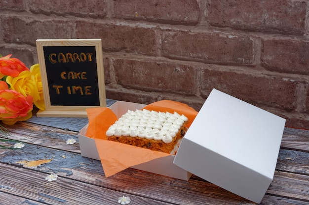 Homemade carrot cake on wooden table