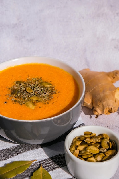 Photo homemade carrot ginger curcuma soup seasonal pumpkin traditional soup with creamy silky texture
