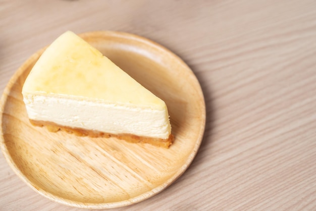 Homemade Cheese cake or butter cake put on wooden plate or dish and place on table