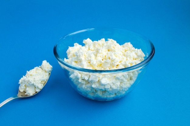 Homemade cheese in the glass bowl