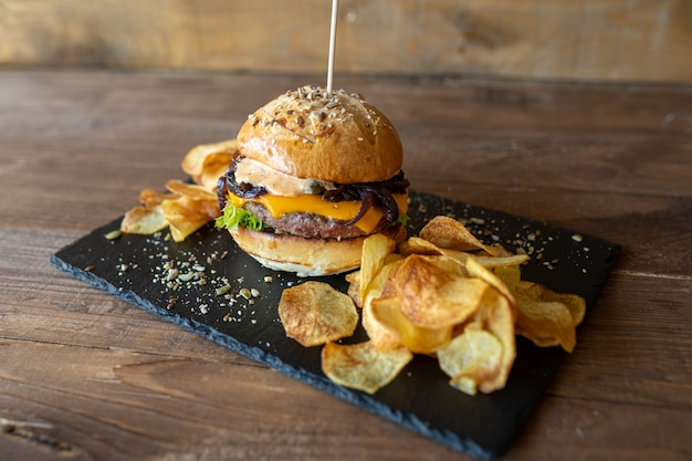 Homemade cheeseburger with chips