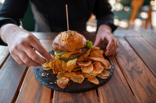 Homemade cheeseburger with chips