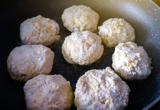 Homemade cheesecakes fried on the pan.