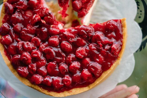 Homemade cherry cake on white plate Food delivery Homemade baking Top view