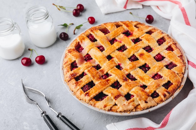 Homemade Cherry Pie with a Flaky Crust on Grey stone background