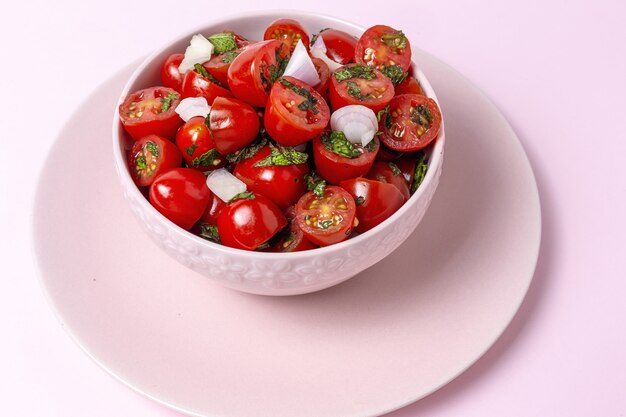 Homemade cherry tomato salad with fresh onions, mint, olive oil and salt