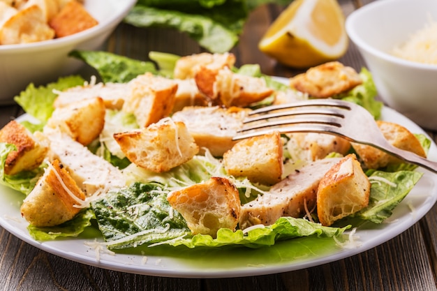 Homemade Chicken Caesar Salad with Cheese and Croutons.