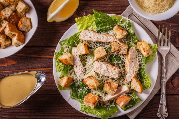 Homemade chicken Caesar Salad with cheese and croutons