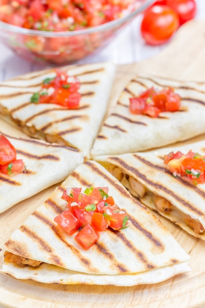 Homemade chicken and cheese quesadilla with salsa