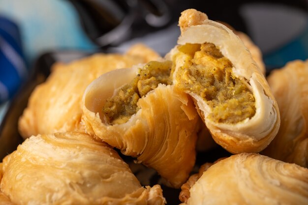 Homemade chicken Curry puffs on wooden table