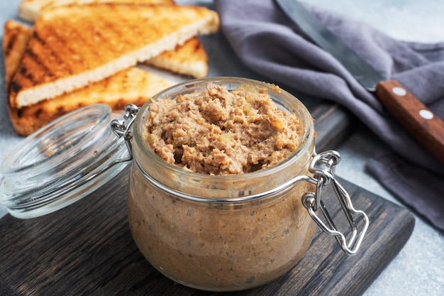 Homemade chicken liver pate in a glass jar.