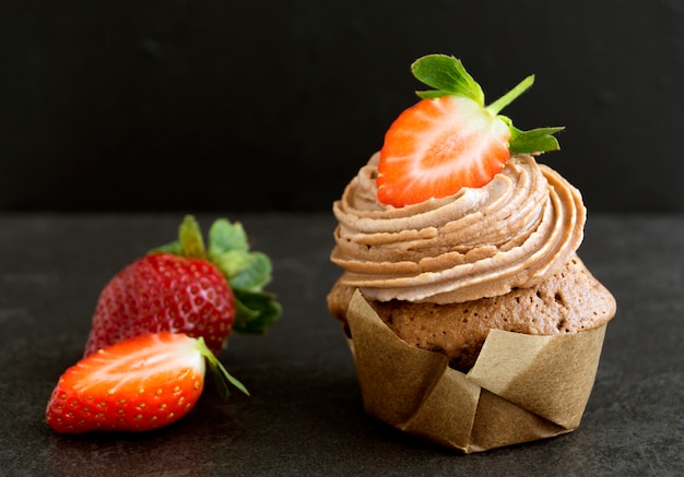 Homemade chocolate cake with cream and strawberry.