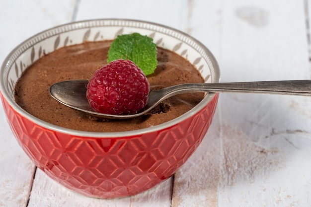 Homemade chocolate mousse with fresh raspberres