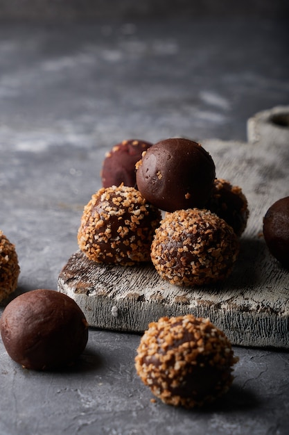 Homemade chocolate sweets-truffles Chocolate tasty snack On grey