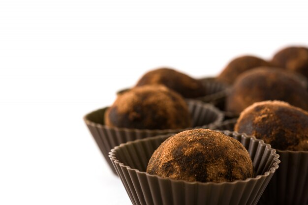 Homemade chocolate truffles isolated on white background