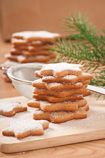 Homemade Christmas cookies sprinkled with powdered sugar