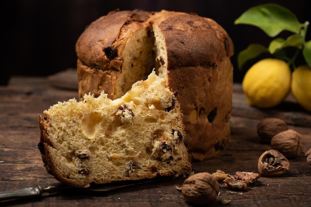 Homemade Christmas Even Panettone on a rustic wooden table close up