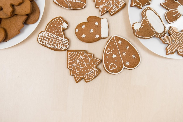 Homemade christmas gingerbread cookies on wooden background