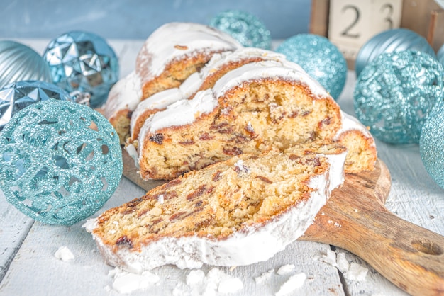 Homemade Christmas Stollen Cake with Icing Sugar, Marzipan and Raisins.